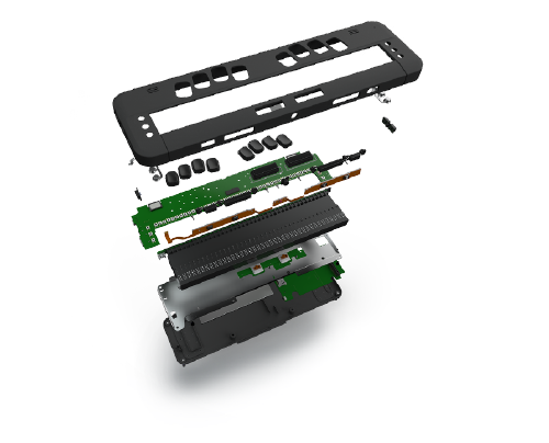 Exploded view of the interior and exterior components of a HumanWare braille device.