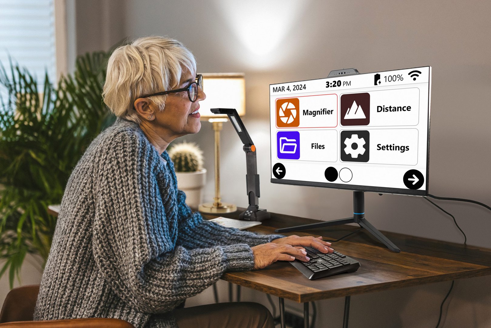 A woman reading on the screen of the Prodigi All-in-One PC.