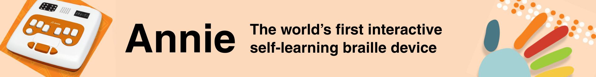 Annie, a white and orange device with various buttons and interfaces for learning braille. Next to it, a colorful hand on braille. 