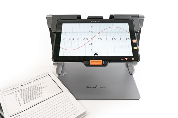 Image of The Connect 12 smart portable magnifier viewing an online document of a math graph next to a textbook.