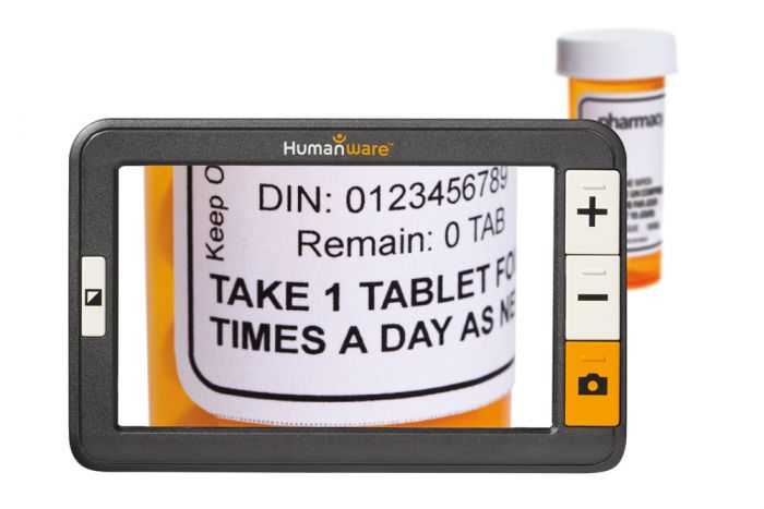 Image of Exploré 5 magnifier used to read a medication label.